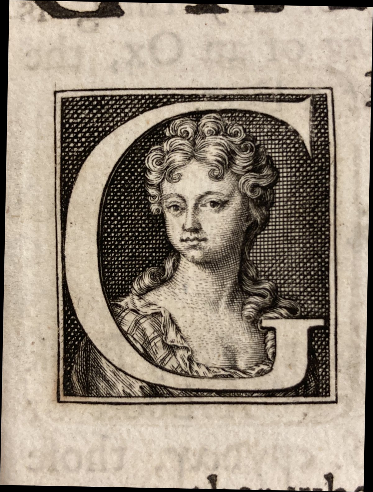 An engraved portrait of an 18th-century woman, within a letter 'G': Elizabeth Elstob..