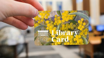 Hand holding a National Library card