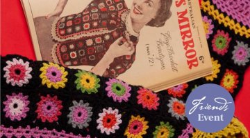 Close up of book and colourful crochet blanket