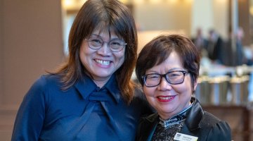 Catherine Law of Opalgate Foundation and National Library of Australia Council member Alice Wong smiling for a photo at the 2024 Patron Dinner