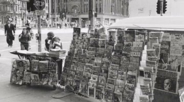 Newspaper seller on the corner of Park and George Streets, Sydney, 1997 / Raymond de Berquelle