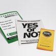 Three pamphlets on a white background. The middle one has text reading 'Yes or No'