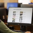 Woman using a computer to explore research guides on the National Library website