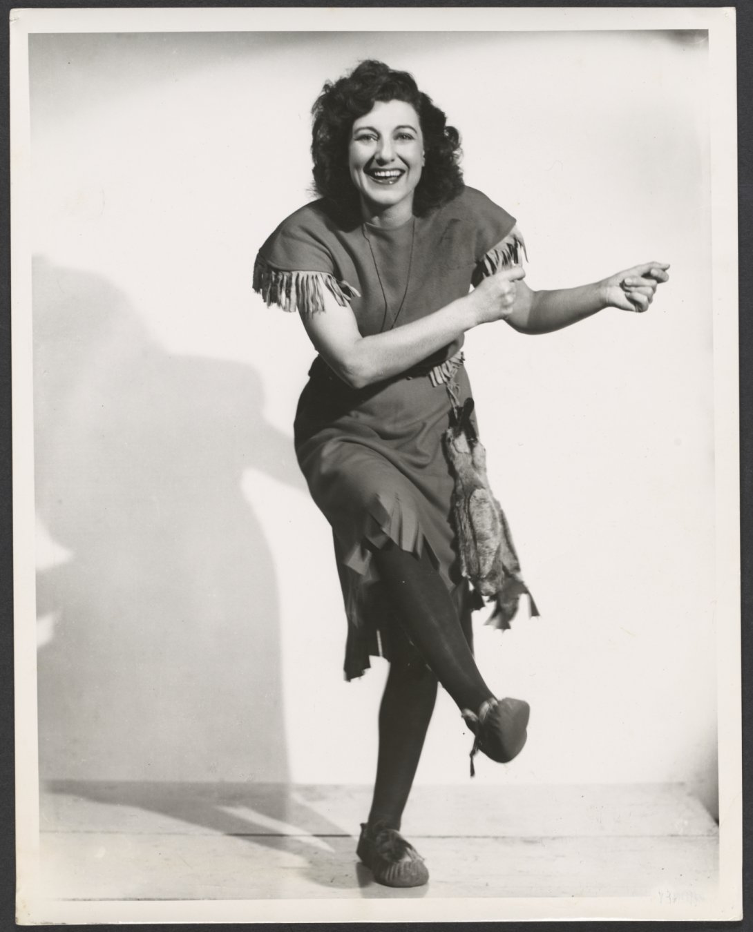 Black and white photograph of a woman dancing