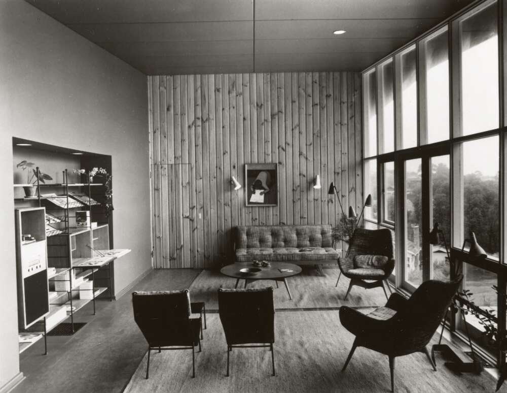 Interior of a house featuring wooden panels and mid century furniture