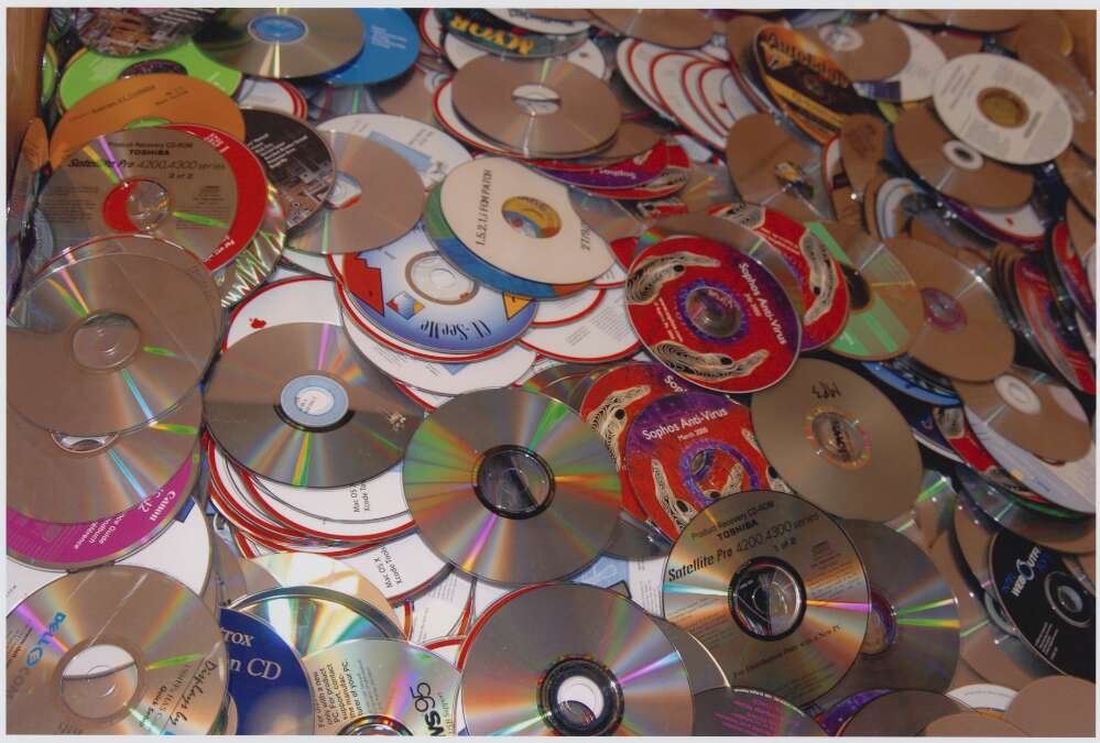 Various CDs stacked up on top of each other