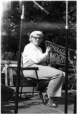 Black and white photograph of Wendy Lowenstein sitting on a seat