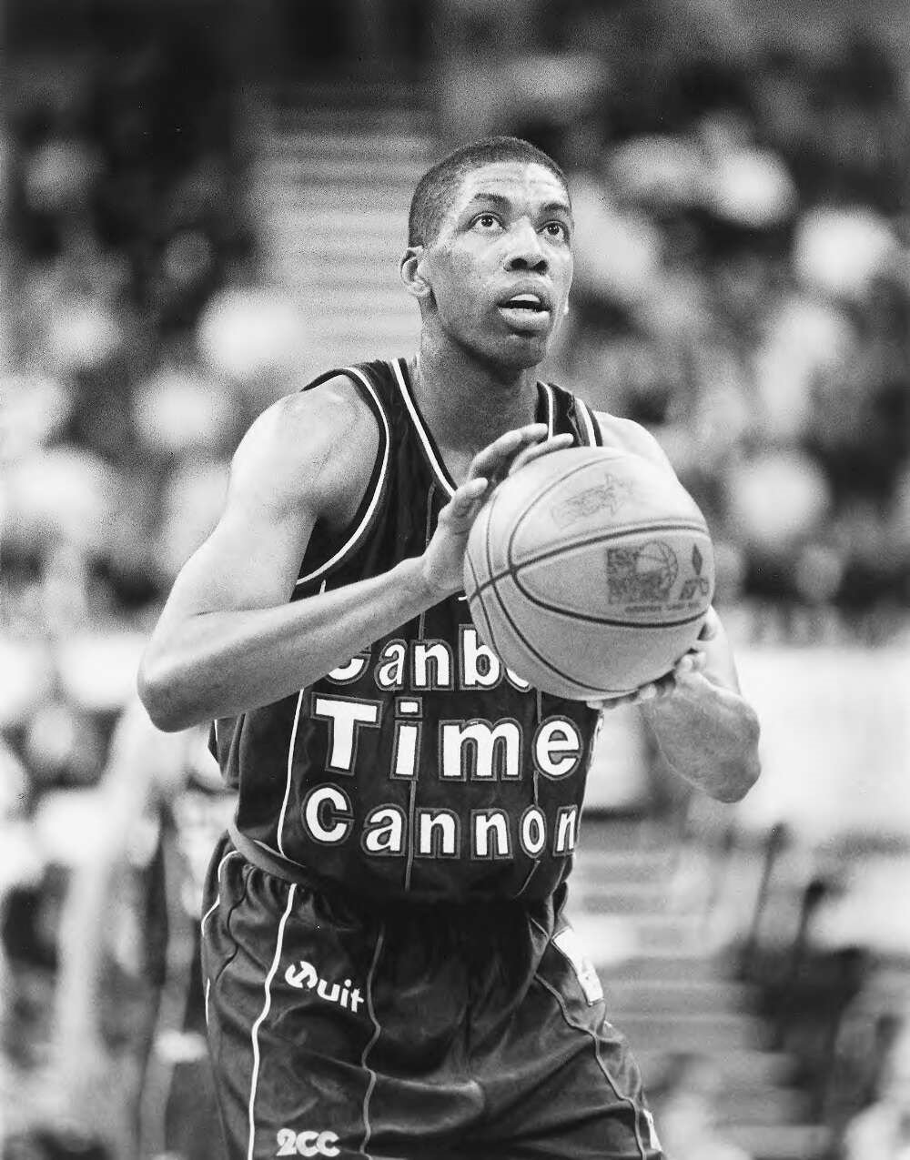 Robert Rose taking a shot whilst playing basketball