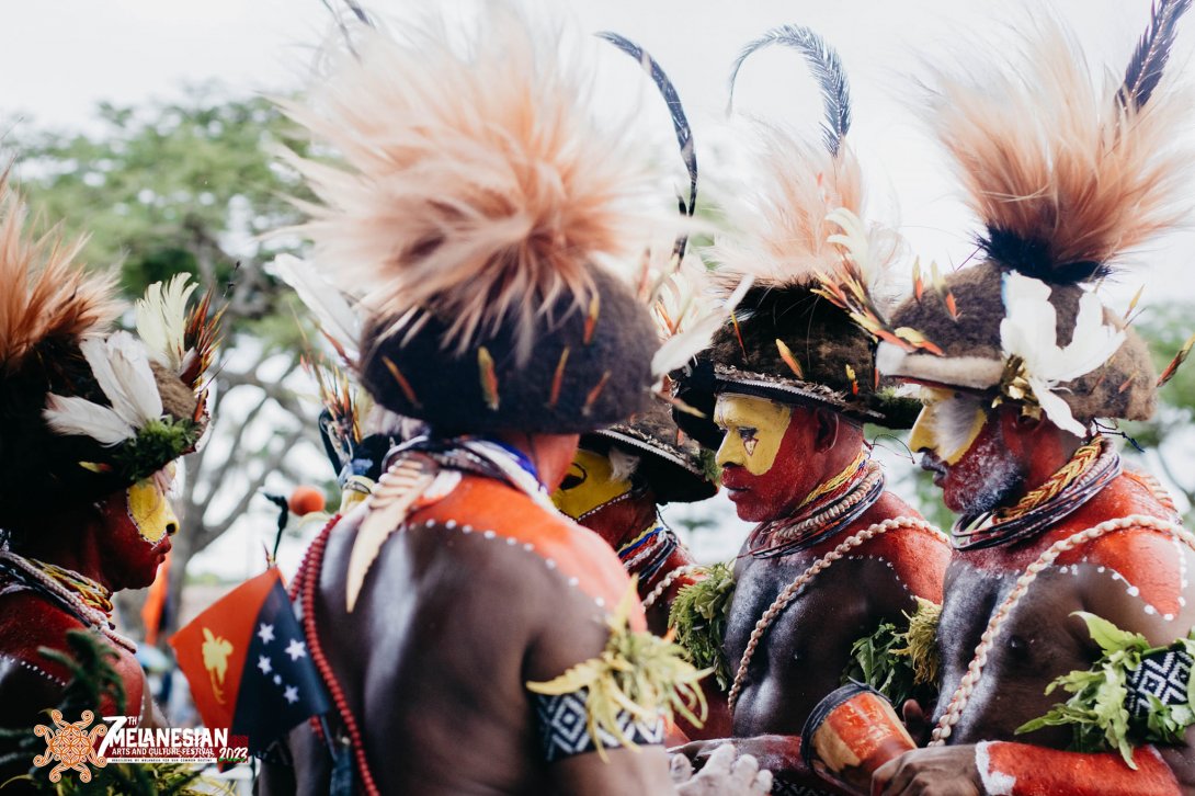 Men from the Papua New Guinean dance group wearing facepaint and cultural dress